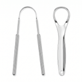 Two polished stainless steel tongue scrapers, U-wire and teardrop paddle styles, on white